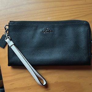 Coach leather medium sized double wristlet. Holds Average sized phone.